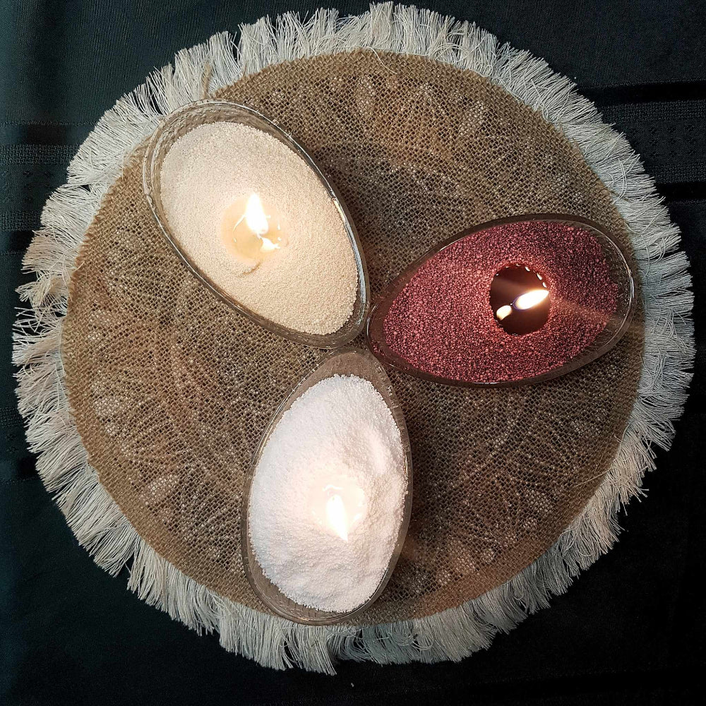 Wine red, White and nude Lumizen candle sand burning in glass dish