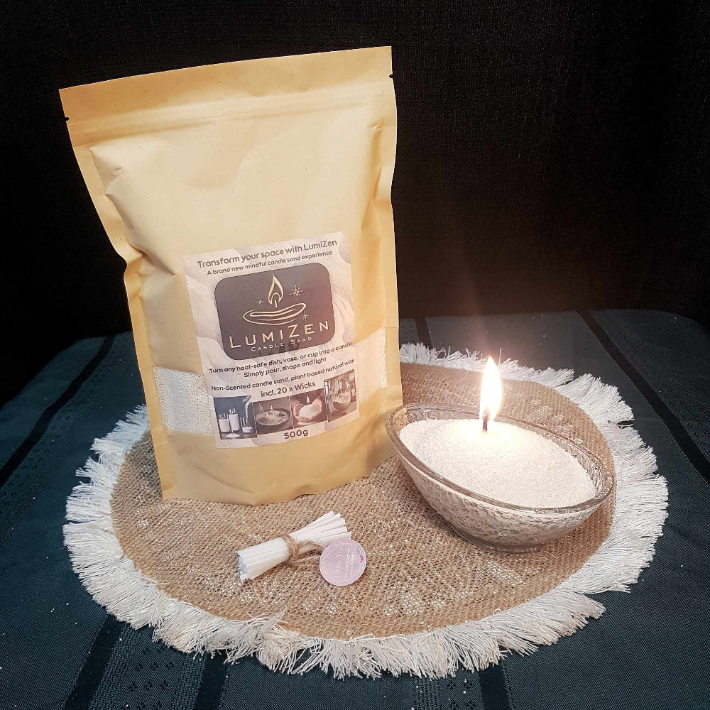 Lumizen candle sand nude_500g in bag set up next to lit candle sand display