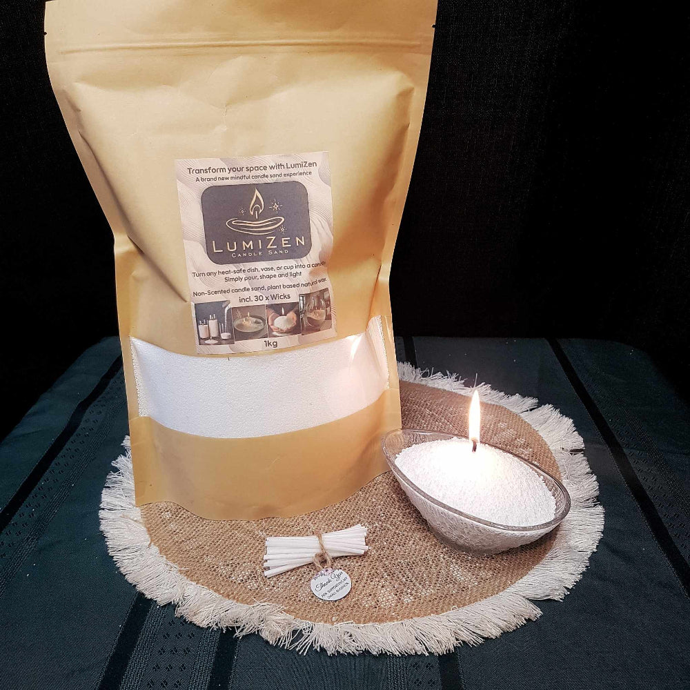 Lumizen candle sand white 1kg in bag sitting on table with display candle sand set up and wick bundle 
